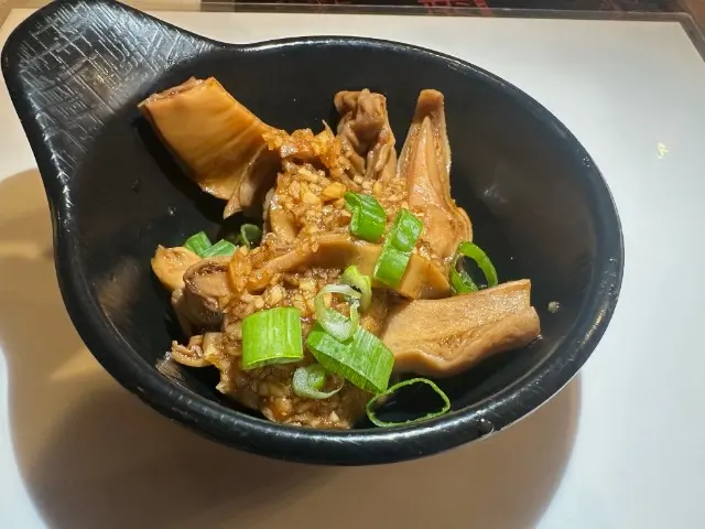 T-Pot&BBQ-Asian-Fusion-Restaurant-Braised-Pork-Tripe-College-Park Braised Pork Tripe - Flavorful braised pork tripe garnished with garlic and scallions at T-Pot & BBQ, a Asian Fusion Restaurant in College Park