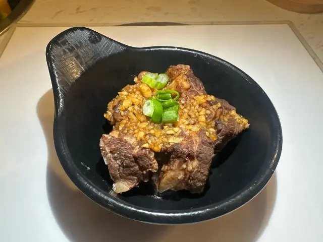 T-Pot&BBQ-Asian-Fusion-Restaurant-Braised-Spare-Ribs-College-Park Braised Spare Ribs - Tender braised spare ribs with garlic and scallion garnish at T-Pot & BBQ, a Asian Fusion Restaurant in College Park